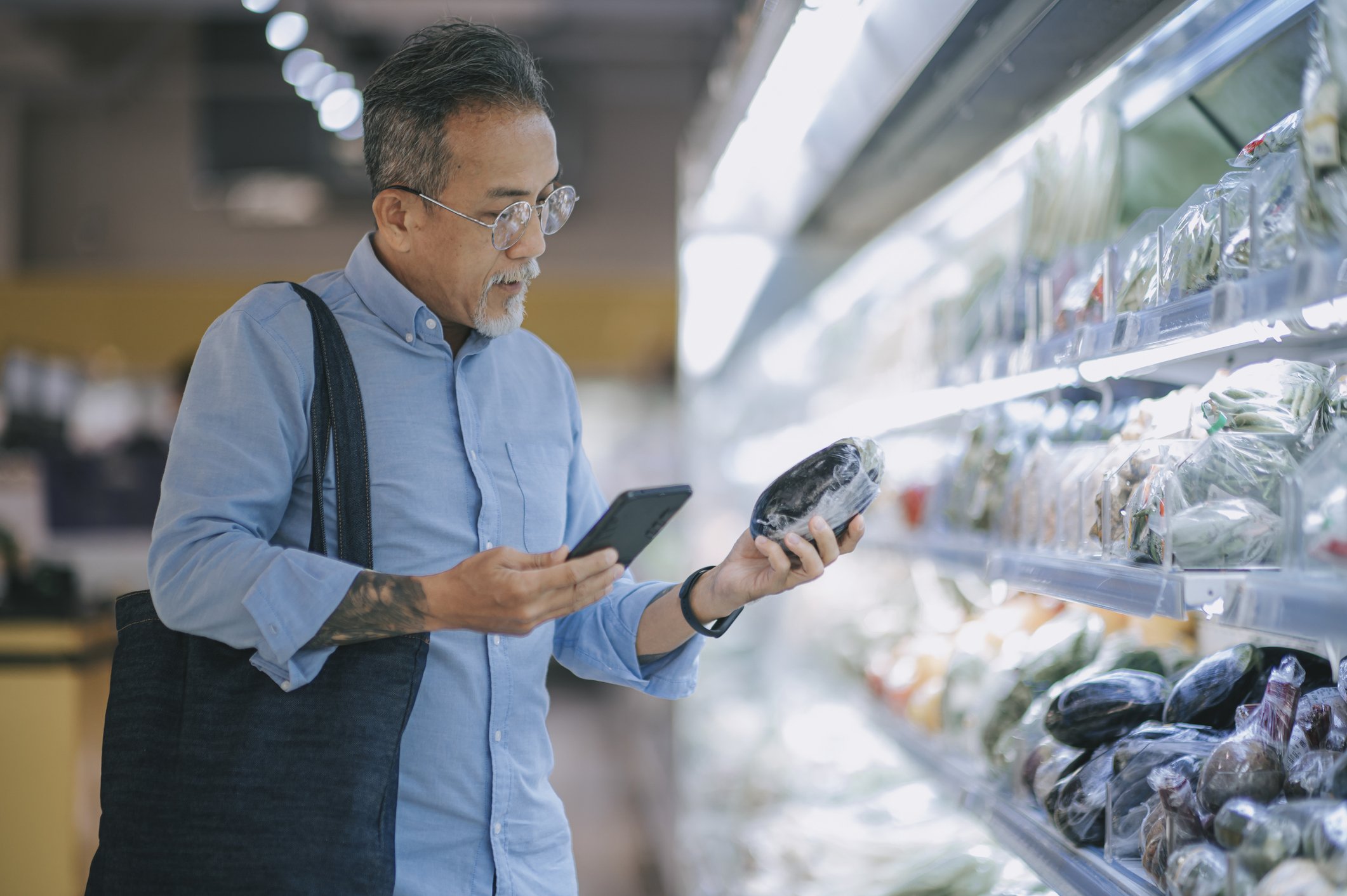Man looking at groceries